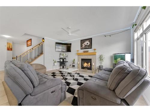 104 Saddlecrest Green Ne, Calgary, AB - Indoor Photo Showing Living Room With Fireplace