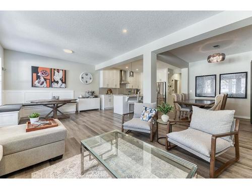 50 Wolf Hollow Way Se, Calgary, AB - Indoor Photo Showing Living Room With Fireplace