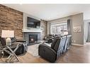 505 Cranford Drive Se, Calgary, AB  - Indoor Photo Showing Living Room With Fireplace 