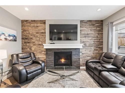 505 Cranford Drive Se, Calgary, AB - Indoor Photo Showing Living Room With Fireplace