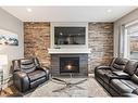 505 Cranford Drive Se, Calgary, AB  - Indoor Photo Showing Living Room With Fireplace 