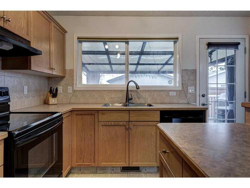 142 Cramond Circle Se, Calgary, AB - Indoor Photo Showing Kitchen With Double Sink
