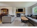 142 Cramond Circle Se, Calgary, AB  - Indoor Photo Showing Living Room With Fireplace 
