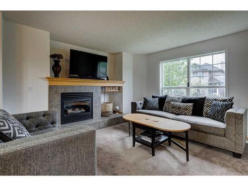 142 Cramond Circle Se, Calgary, AB - Indoor Photo Showing Living Room With Fireplace