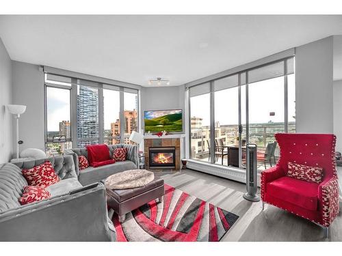 #2301-650 10 Street Sw, Calgary, AB - Indoor Photo Showing Living Room With Fireplace