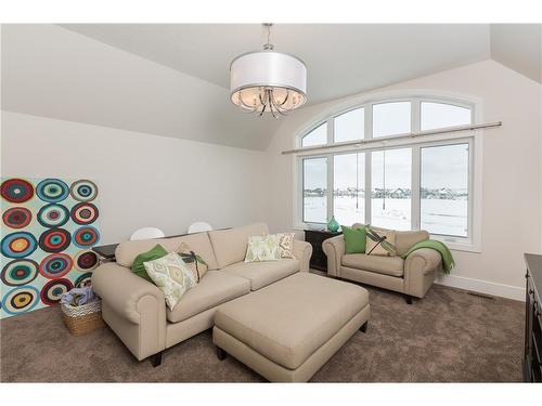 38 Waters Edge Drive, Heritage Pointe, AB - Indoor Photo Showing Living Room