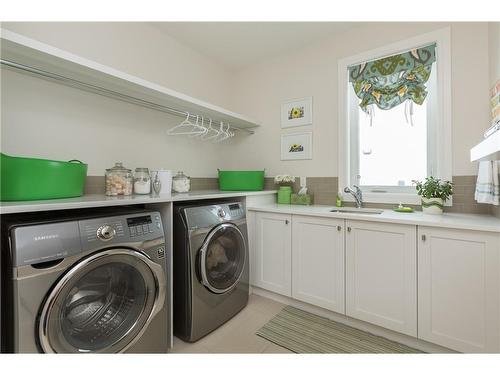 38 Waters Edge Drive, Heritage Pointe, AB - Indoor Photo Showing Laundry Room