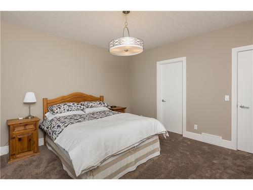 38 Waters Edge Drive, Heritage Pointe, AB - Indoor Photo Showing Bedroom