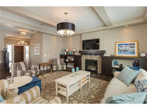 38 Waters Edge Drive, Heritage Pointe, AB - Indoor Photo Showing Living Room With Fireplace