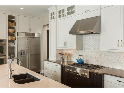 38 Waters Edge Drive, Heritage Pointe, AB - Indoor Photo Showing Kitchen With Double Sink With Upgraded Kitchen