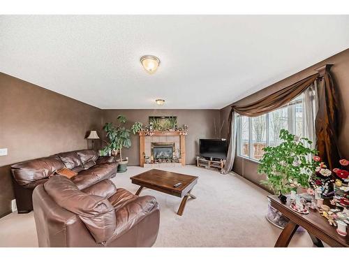 10 Royal Elm Drive Nw, Calgary, AB - Indoor Photo Showing Living Room With Fireplace