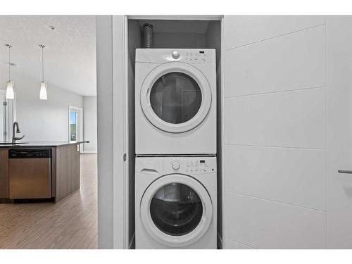 202-4 Sage Hill Terrace Nw, Calgary, AB - Indoor Photo Showing Laundry Room