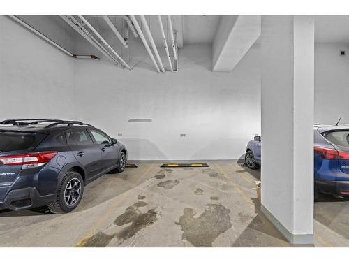 215-8445 Broadcast Avenue Sw, Calgary, AB - Indoor Photo Showing Garage