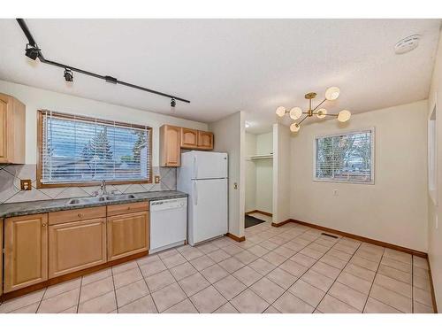 32 Penrith Place Se, Calgary, AB - Indoor Photo Showing Kitchen With Double Sink