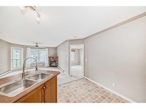 303-369 Rocky Vista Park Nw, Calgary, AB - Indoor Photo Showing Kitchen With Double Sink