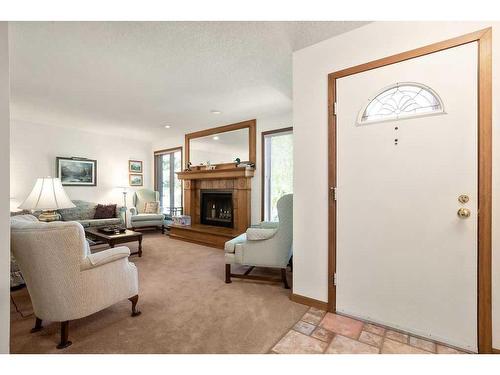 95 Macewan Meadow Crescent Nw, Calgary, AB - Indoor Photo Showing Living Room With Fireplace