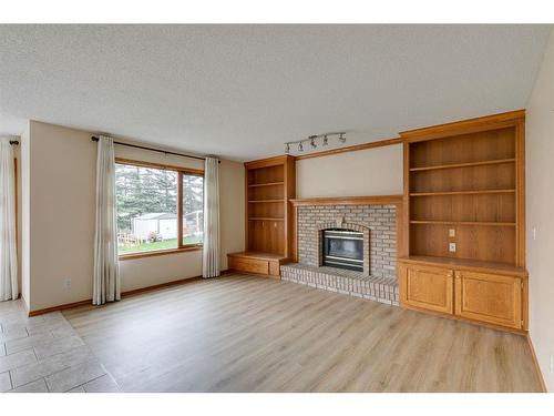 78 Hampstead Circle Nw, Calgary, AB - Indoor Photo Showing Living Room With Fireplace