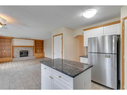 78 Hampstead Circle Nw, Calgary, AB - Indoor Photo Showing Kitchen With Fireplace