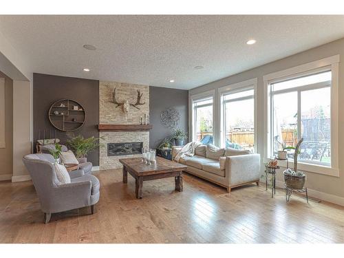 444 Auburn Shores Landing Se, Calgary, AB - Indoor Photo Showing Living Room With Fireplace