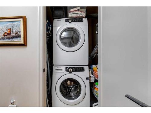 106-201 Quarry Way Se, Calgary, AB - Indoor Photo Showing Laundry Room