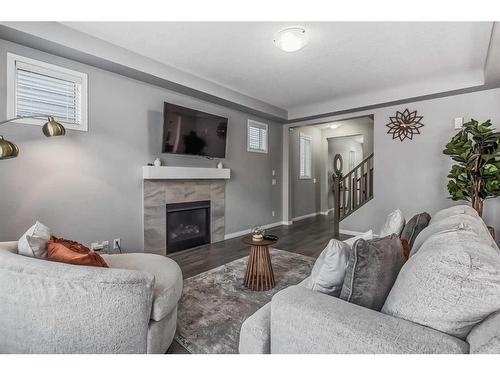 118 Windrow Link Sw, Airdrie, AB - Indoor Photo Showing Living Room With Fireplace