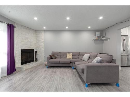 2421 146 Avenue Se, Calgary, AB - Indoor With Fireplace
