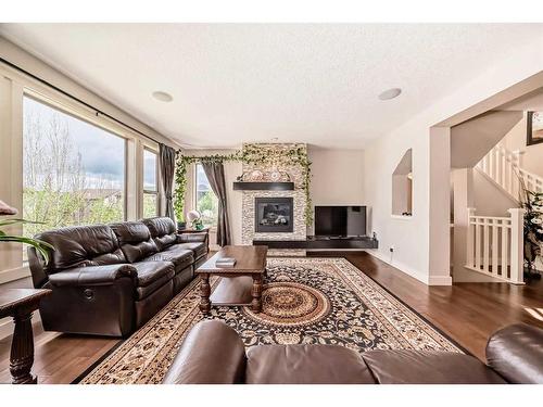 483 Evergreen Circle Sw, Calgary, AB - Indoor Photo Showing Living Room With Fireplace