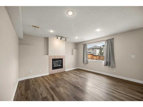244 Citadel Way Nw, Calgary, AB - Indoor Photo Showing Living Room With Fireplace