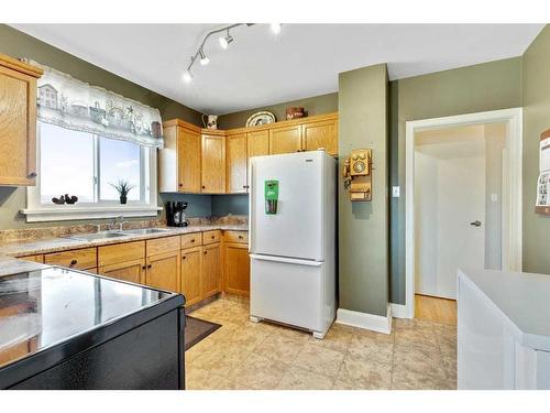 14 594 Avenue West, Rural Foothills County, AB - Indoor Photo Showing Kitchen With Double Sink