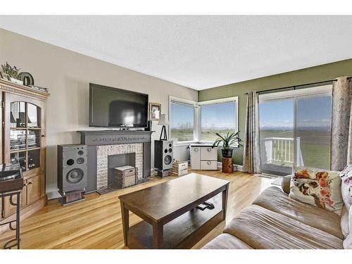 14 594 Avenue West, Rural Foothills County, AB - Indoor Photo Showing Living Room With Fireplace