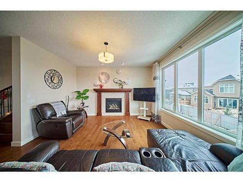 190 Evansridge Place Nw, Calgary, AB - Indoor Photo Showing Living Room With Fireplace