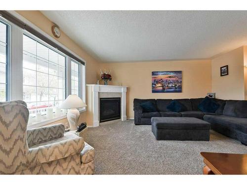 63 Sierra Morena Gardens Sw, Calgary, AB - Indoor Photo Showing Living Room With Fireplace