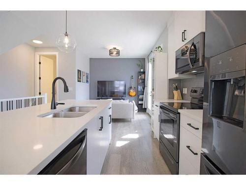 1933 19 Avenue Nw, Calgary, AB - Indoor Photo Showing Kitchen With Double Sink With Upgraded Kitchen