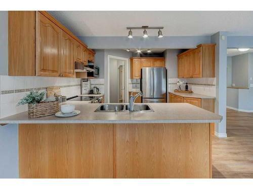 53 Valley Stream Circle Nw, Calgary, AB - Indoor Photo Showing Kitchen With Double Sink