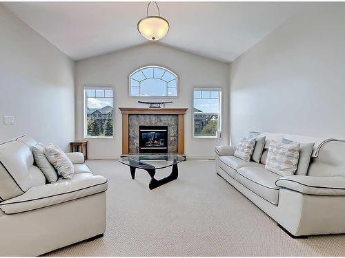 967 Bayside Drive Sw, Airdrie, AB - Indoor Photo Showing Living Room With Fireplace