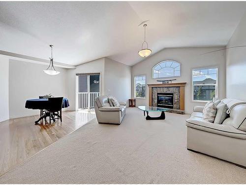 967 Bayside Drive Sw, Airdrie, AB - Indoor Photo Showing Living Room With Fireplace