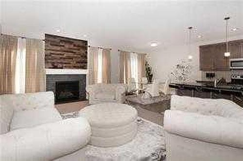 244 Walden Parade Se, Calgary, AB - Indoor Photo Showing Living Room With Fireplace