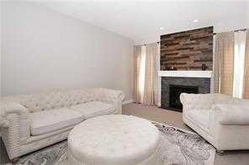 244 Walden Parade Se, Calgary, AB - Indoor Photo Showing Living Room With Fireplace