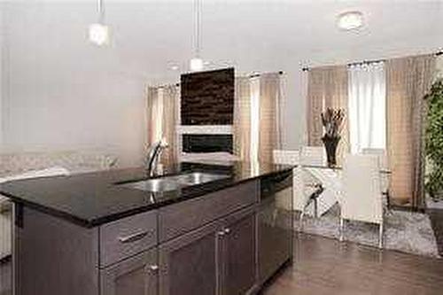 244 Walden Parade Se, Calgary, AB - Indoor Photo Showing Kitchen With Double Sink