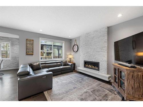 547 Panora Way Nw, Calgary, AB - Indoor Photo Showing Living Room With Fireplace