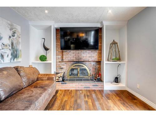 6904 Silver Springs Road Nw, Calgary, AB - Indoor Photo Showing Living Room With Fireplace