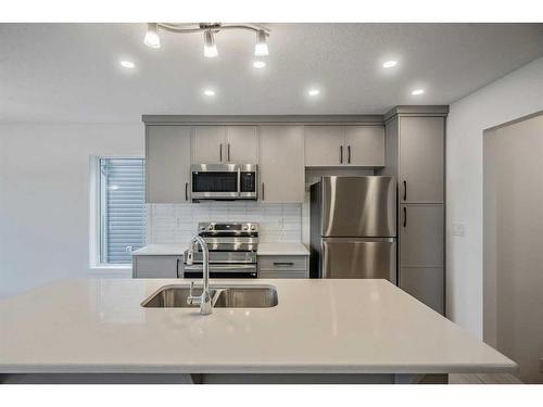 27 Carringwood Manor Nw, Calgary, AB - Indoor Photo Showing Kitchen With Double Sink With Upgraded Kitchen