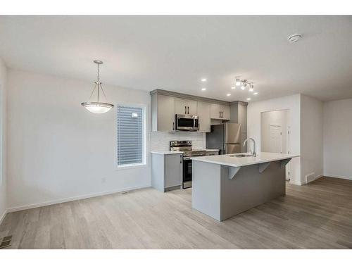 27 Carringwood Manor Nw, Calgary, AB - Indoor Photo Showing Kitchen With Upgraded Kitchen