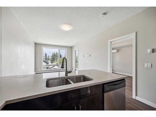 302-607 17 Avenue Nw, Calgary, AB - Indoor Photo Showing Kitchen With Double Sink