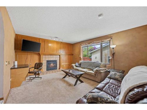 108 Harvest Hills Drive Ne, Calgary, AB - Indoor Photo Showing Living Room With Fireplace