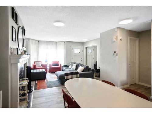 36 Cramond Drive Se, Calgary, AB - Indoor With Fireplace