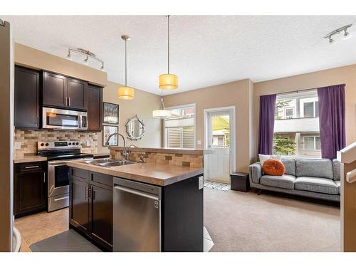 3 Sage Hill Common Nw, Calgary, AB - Indoor Photo Showing Kitchen With Double Sink