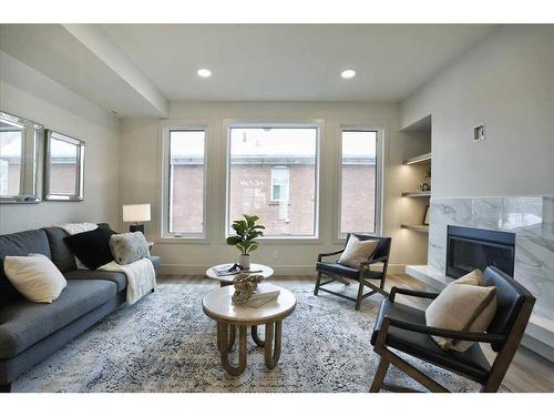 2222 5 Street Sw, Calgary, AB - Indoor Photo Showing Living Room With Fireplace