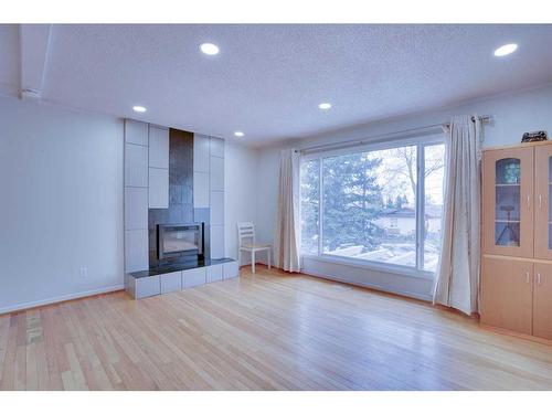 7920 Ranchview Drive Nw, Calgary, AB - Indoor Photo Showing Other Room With Fireplace