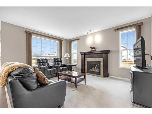 217 Cranarch Close Se, Calgary, AB - Indoor Photo Showing Living Room With Fireplace